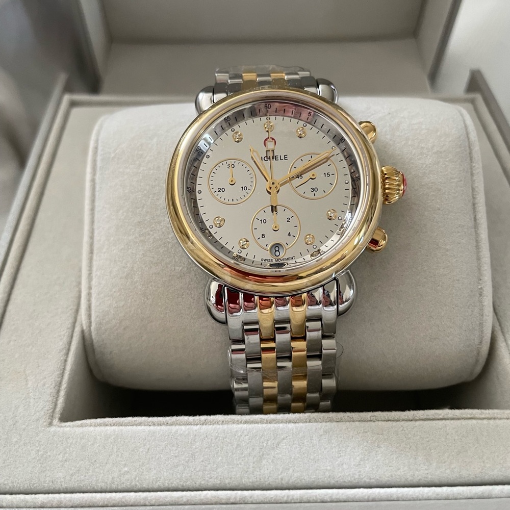 Seven diamond markers, Swiss made watch two-tone bracelet.